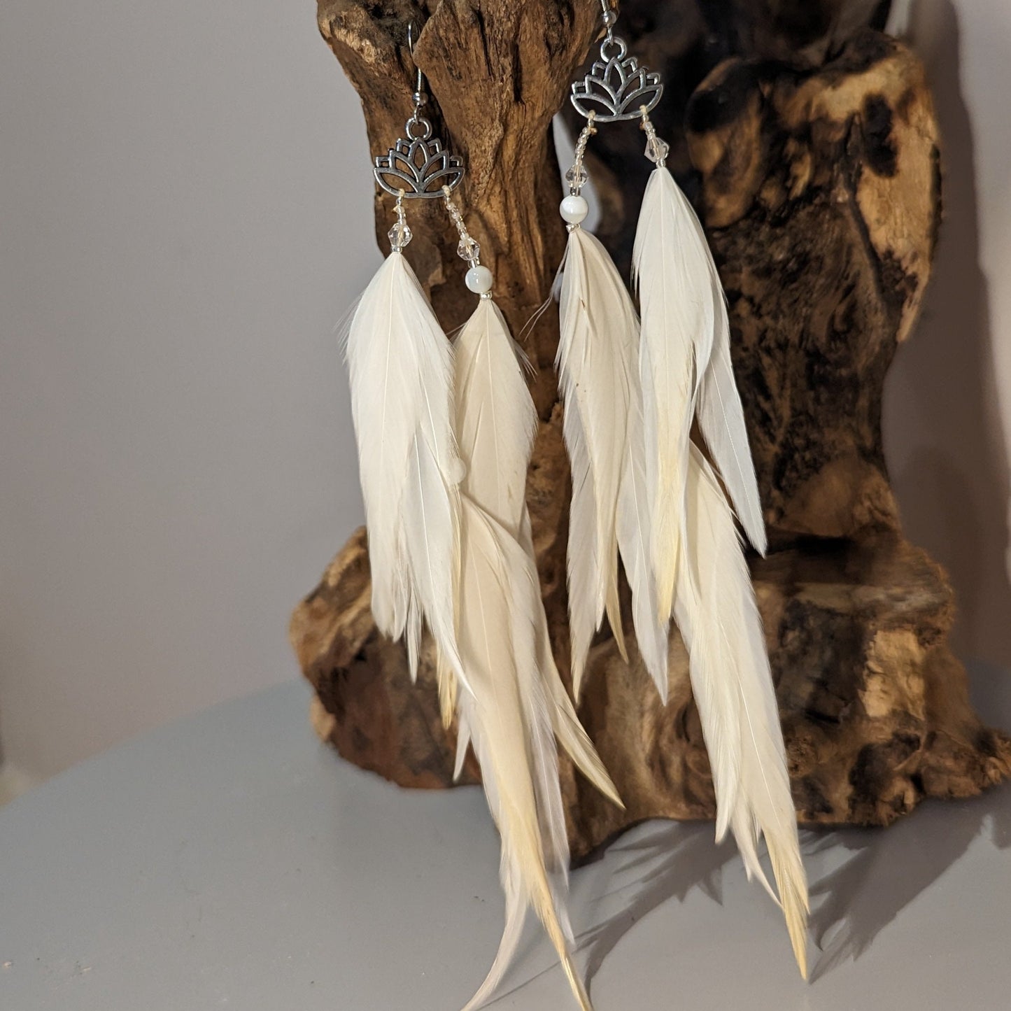 White earrings with feathers